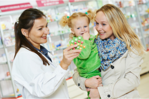 Mother and her child talking to a pharmacist